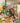 Dinosaur birthday party theme. Big dinosaur foosball ball, dinosaur balloons, serving dishes and dinosaur mugs and plates.