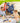 Space-themed kids' party - children sit at the party table amid rocket decorations and blue balloons at a space party.