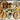 Safari-themed table setting: zebra, leopard, and giraffe patterns, leaf-shaped napkins, and decorations on an adult safari-themed party table.